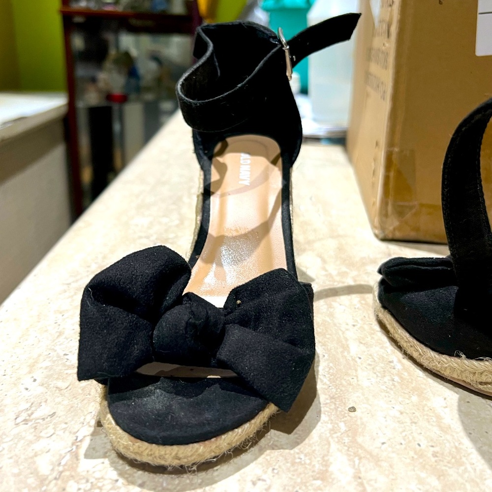 Black espadrille wedge sandals with a bowtie